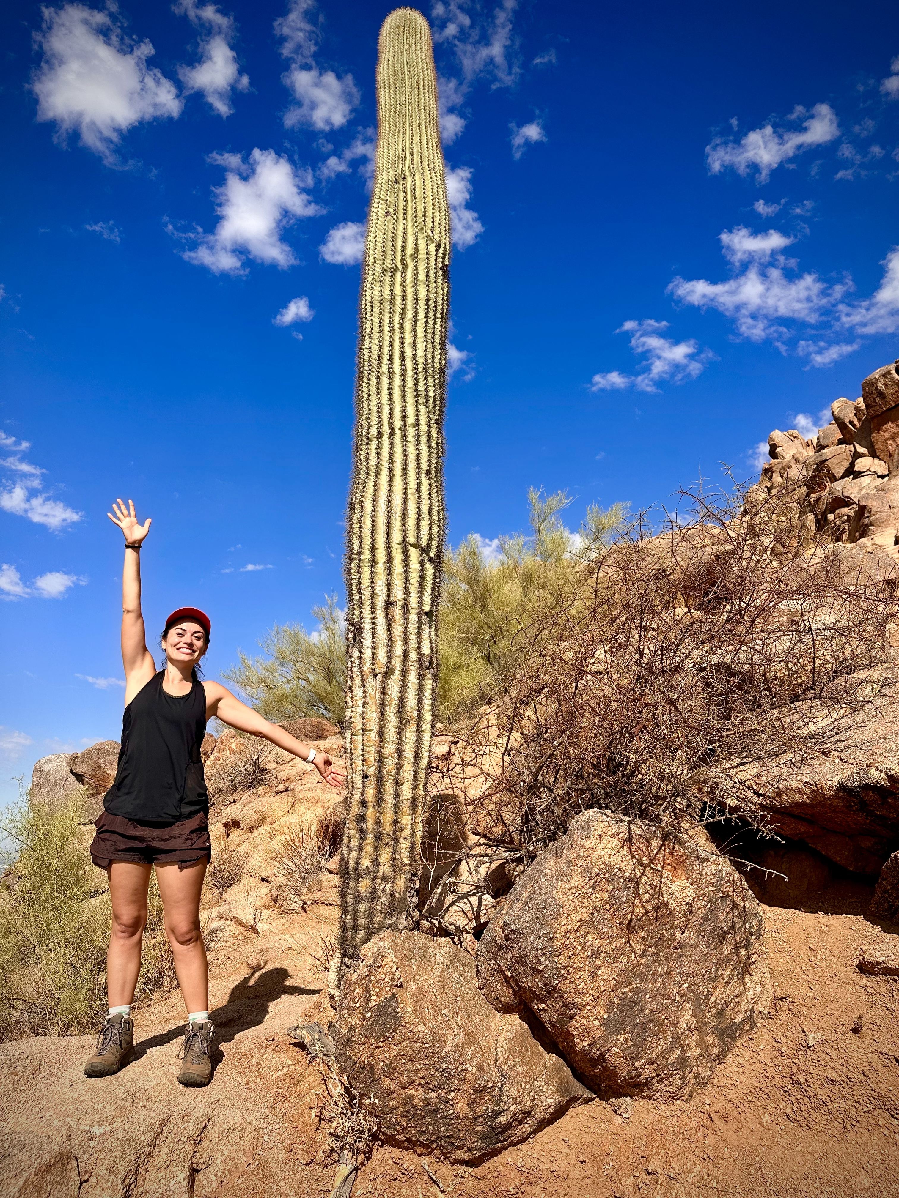Lauren with saguaro during hike up Camelback Mountain in Phoenix, Arizona.