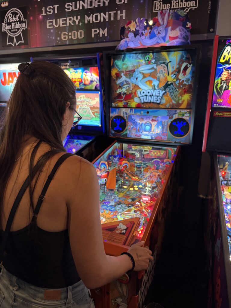 Playing games at The 1Up Arcade Bar